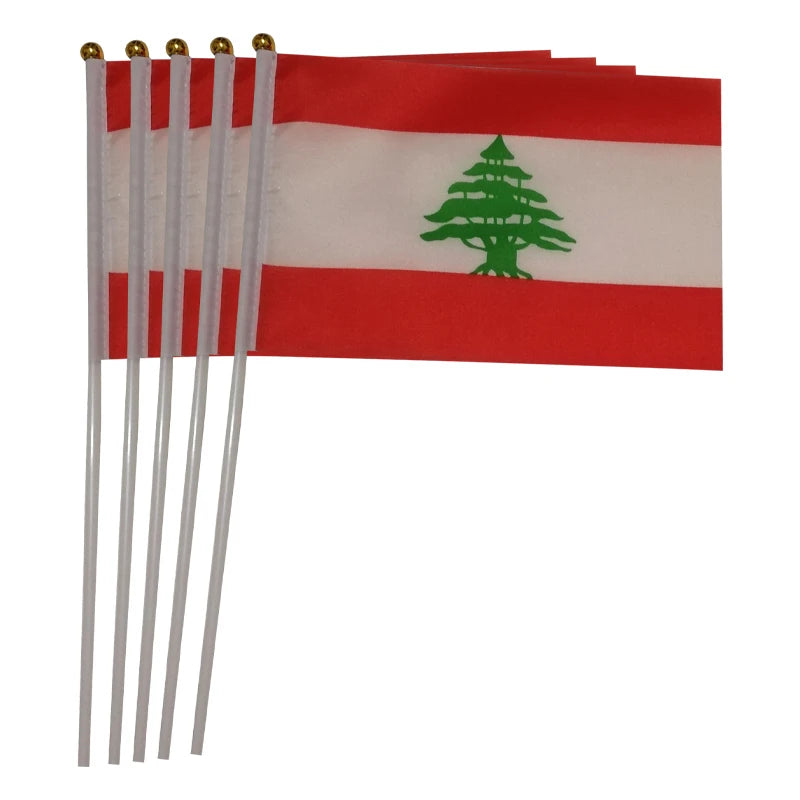 Small handheld Lebanese flag on a stick, featuring the red and white stripes with a green cedar tree, perfect for parades, rallies, or national events.