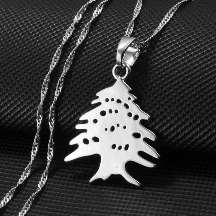 Silver cedar tree pendant necklace, inspired by the Lebanese national symbol, representing strength and heritage with an elegant and refined design.