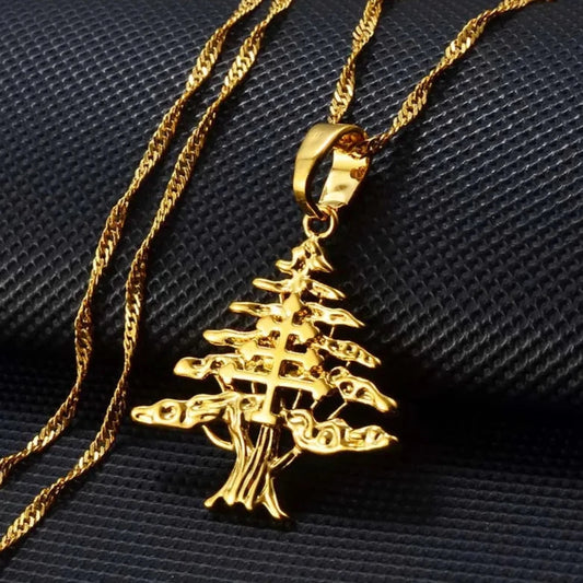 Gold cedar tree pendant necklace, symbolizing Lebanon's heritage, with intricate detailing for a bold and elegant look